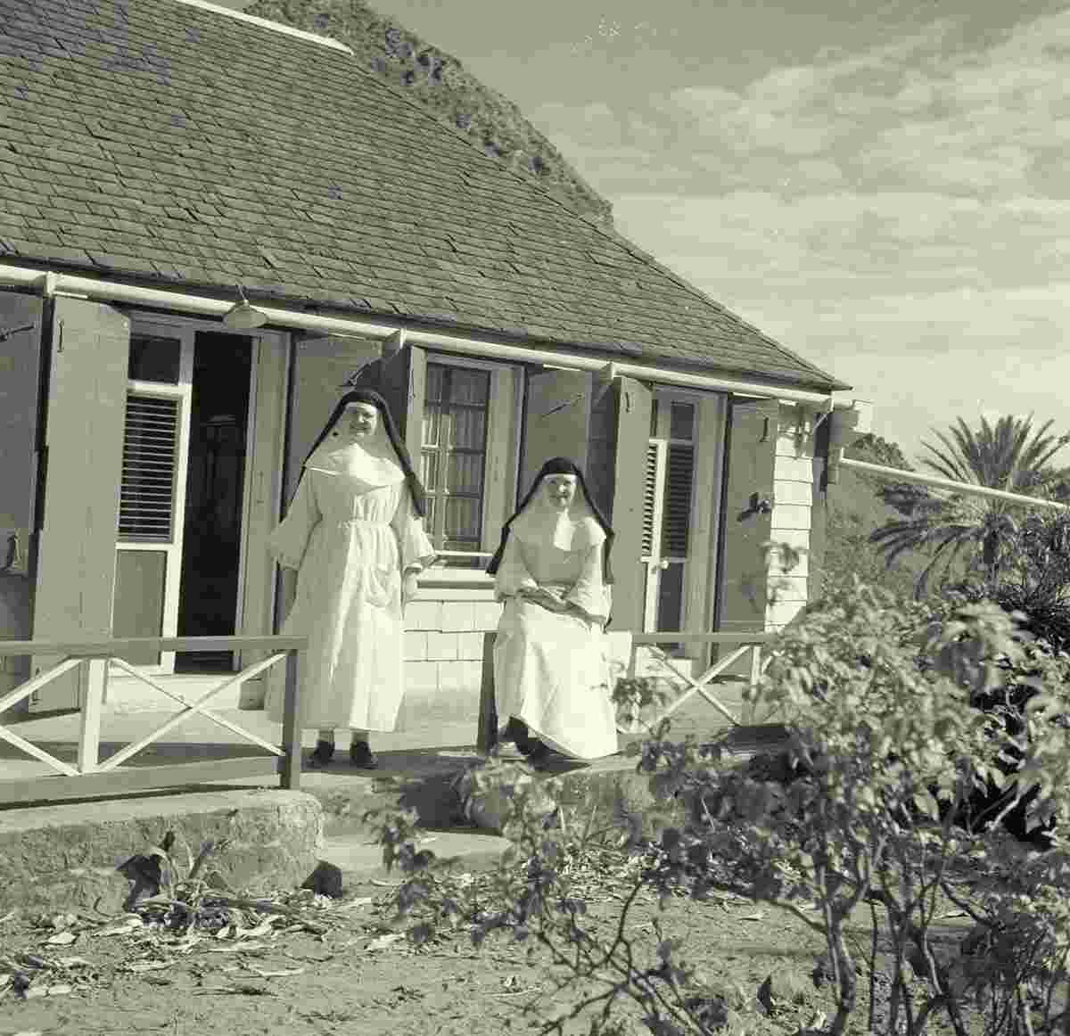 The Botton. Two nuns at a house, 1947